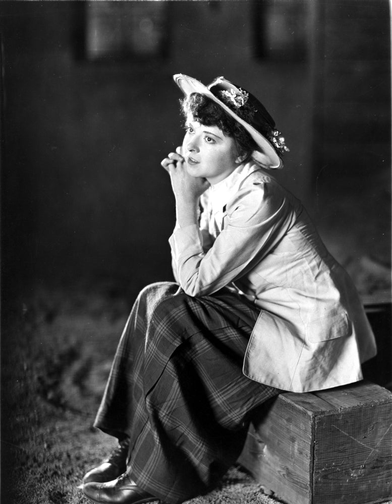 Colleen Moore portrait photo print in a blazer sitting pose.