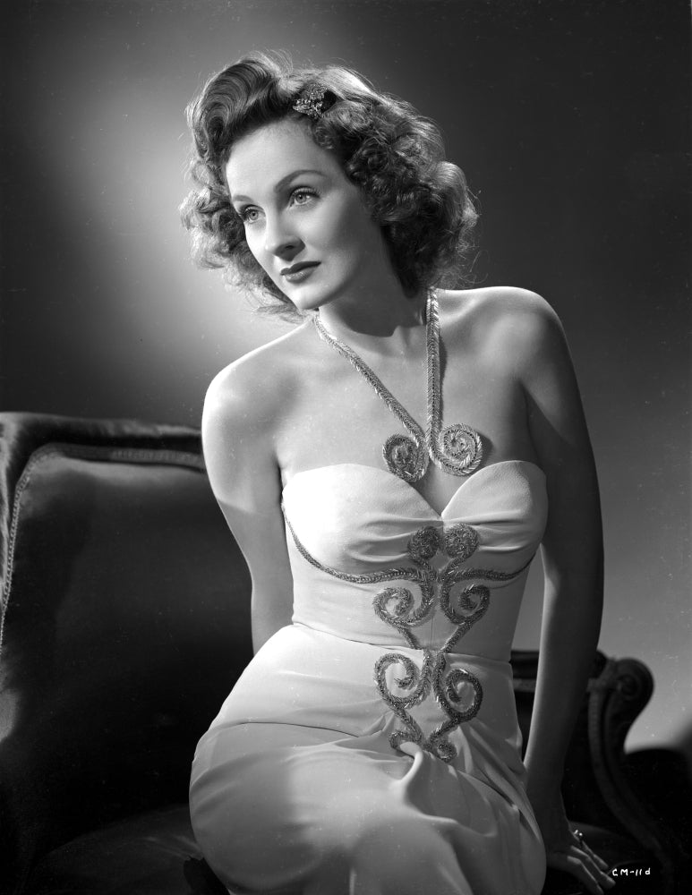 Constance Moore photo print in tube dress sitting and bending