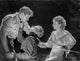 Most Dangerous Game photo print featuring two men fighting and a woman in a black suit and dress.