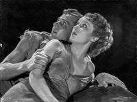 Most Dangerous Game black and white photo print of a couple lying on bed.