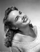 Terry Moore looking up and smiling portrait photo print.