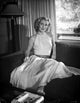 Dolores Moran portrait photo print in a seated pose.