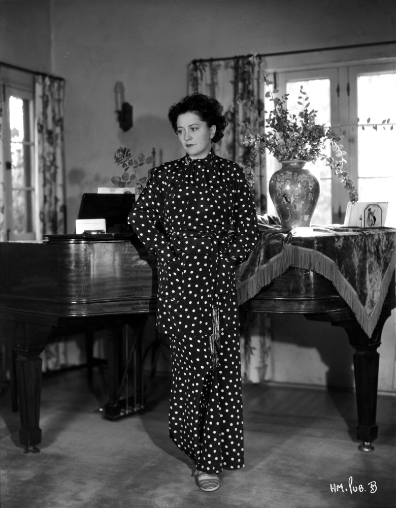 Helen Morgan posed photo print in a printed dress.