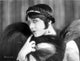 Pola Negri posed wearing a black feather scarf photo print