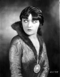 Pola Negri in a stunning printed dress with a big pendant, photo print.