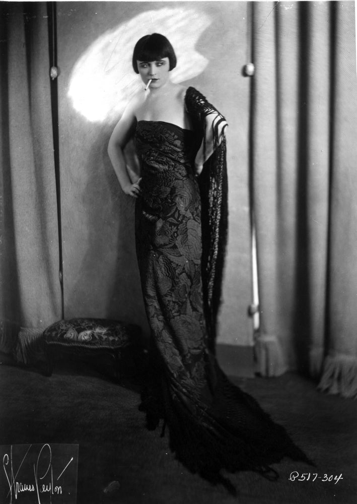 Pola Negri standing in embroidered dress photo print