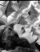 Joan Newton Lying on a Couch Photo Print showcasing a serene moment.