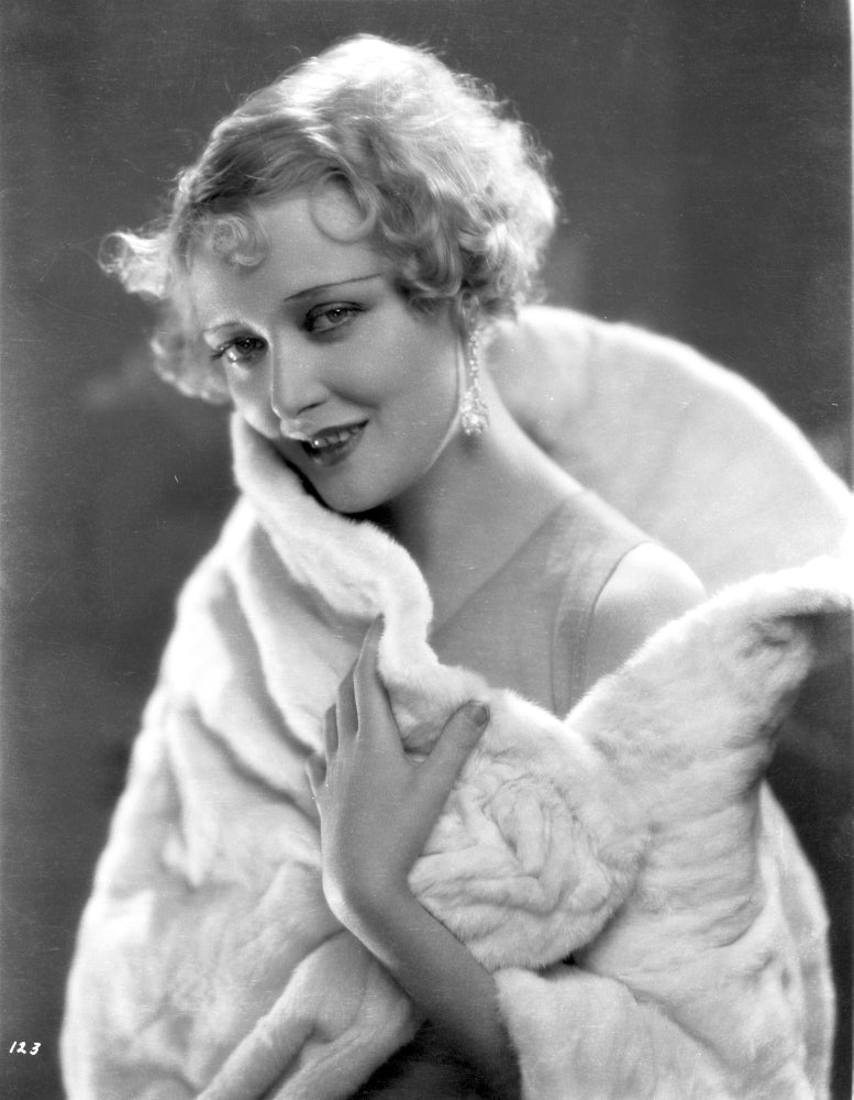 Mary Nolan smiling photo print on furry cloth backdrop