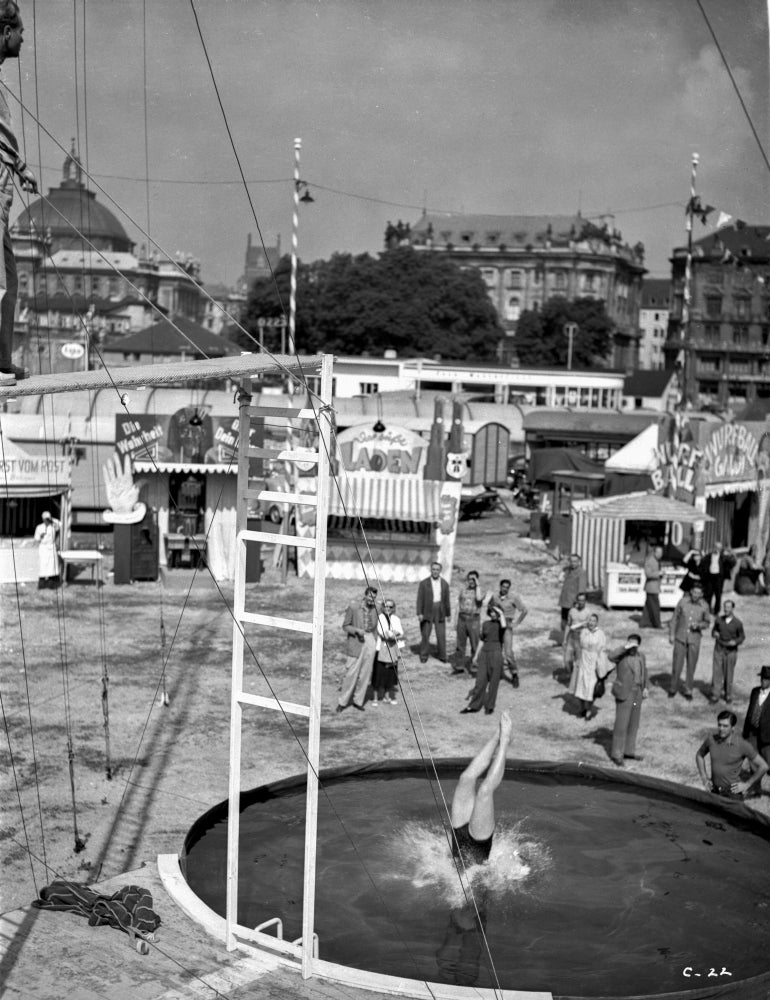 A Scene From Carnival Story Photo Print showcasing vibrant colors and festive atmosphere.