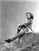 Nell O'Day sitting on a long sleeve top photo print