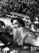 Maureen O'Sullivan smiling on the grass photo print
