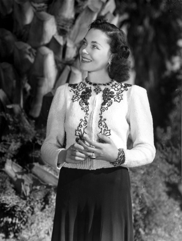 Maureen O'Sullivan smiling in an embroidered dress photo print.