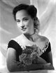 Merle Oberon in off shoulder dress with flowers - vintage photo print.