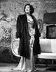 Merle Oberon standing photo print showcasing classic Hollywood glamour.