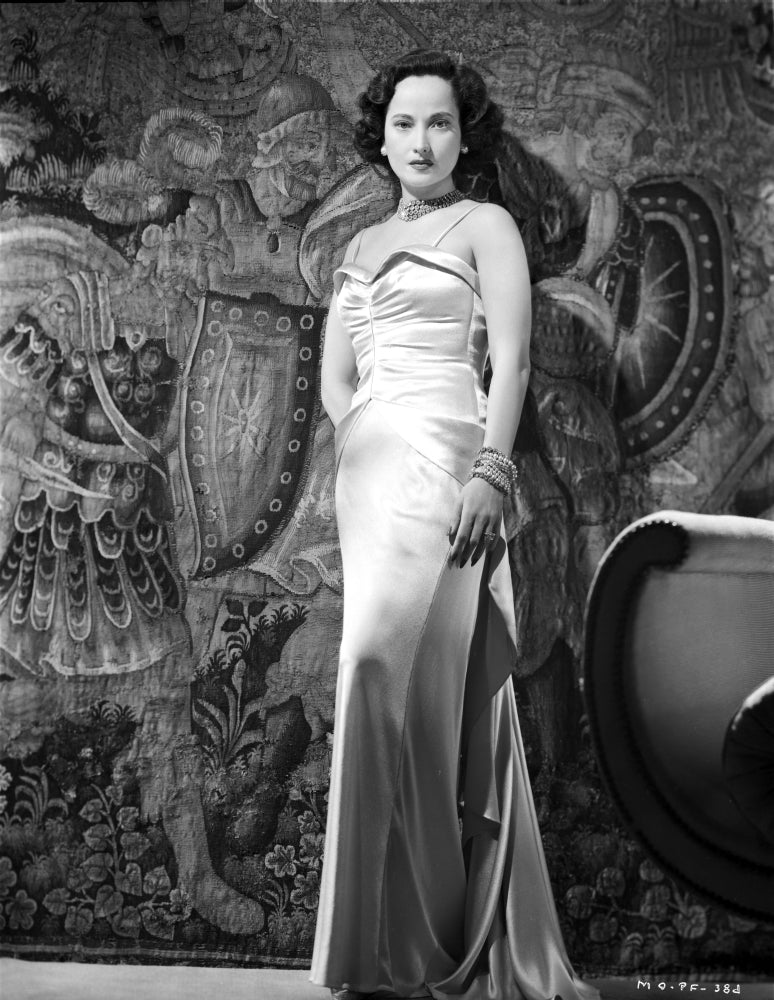 Merle Oberon standing in a silk dress - vintage photo print