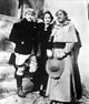 Portrait of Merle Oberon and co-stars in historical costume photo print.
