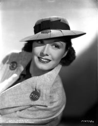 Gail Patrick portrait photo print in coat and hat, smiling.