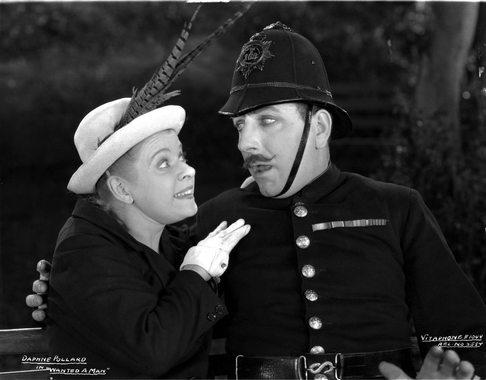 Daphne Pollard smiling to a man photo print