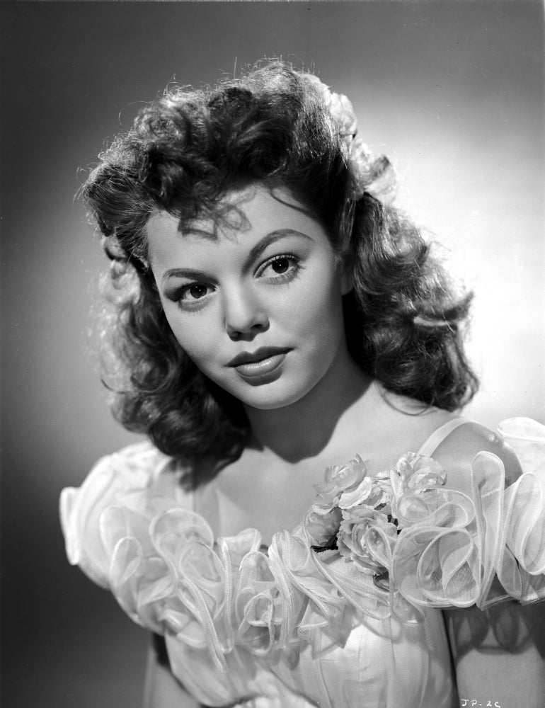 Jean Porter portrait in ruffled and frilled off shoulder silk dress photo print.
