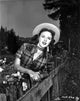 Mala Powers photo print on checkered top in leaning pose.