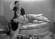 Looking For Danger Couple Lying in Bed Photo Print