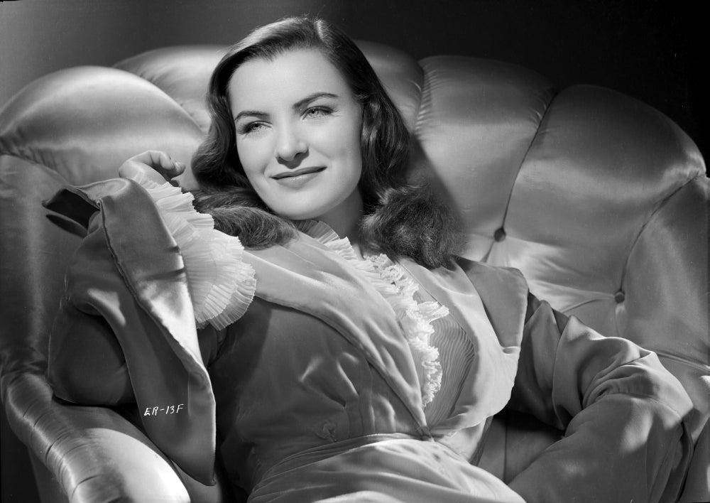 Ella Raines Seated in Robe Photo Print showcasing vintage elegance.