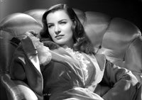 Ella Raines sitting in a ruffled dress photo print