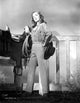 Ella Raines in cowgirl attire photo print showcasing vintage charm.