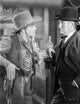 A Scene From the Oklahoma Kid Photo Print showcasing classic cinema.