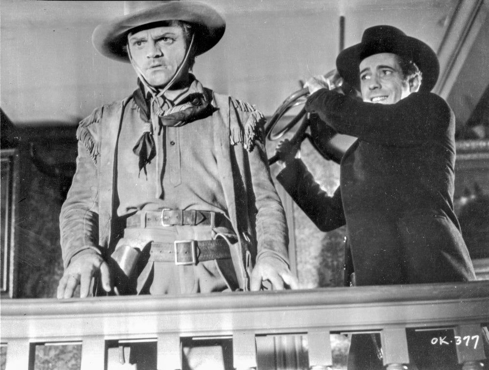 A Scene from The Oklahoma Kid Photo Print featuring classic cinema scene.