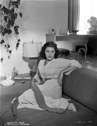 Martha Raye sitting on a couch photo print.