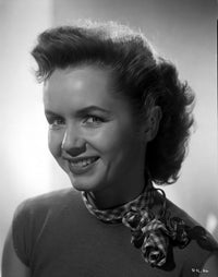Debbie Reynolds smiling with a checkered handkerchief photo print.