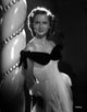 Debbie Reynolds leaning photo print capturing classic Hollywood charm.