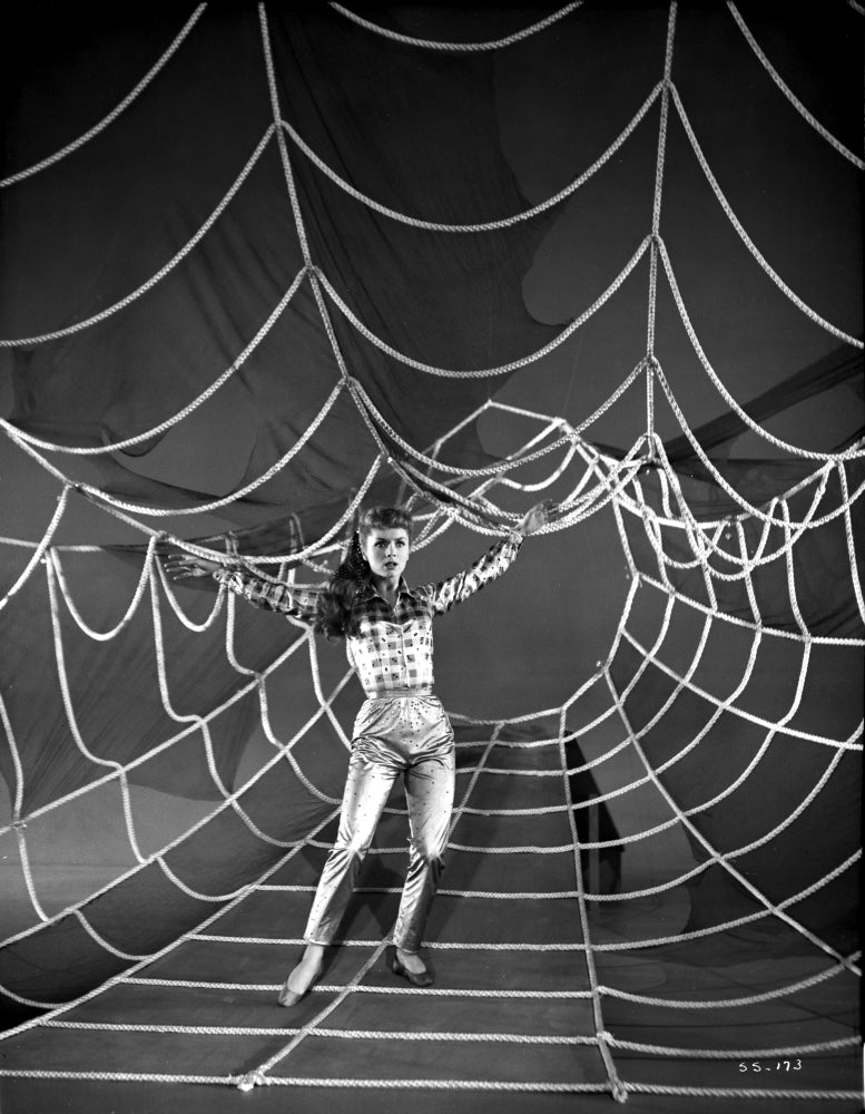 Debbie Reynolds photo print spreading her hand on a spider web