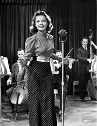 Marjorie Reynolds microphone photo print featuring a crowd, vintage photography.