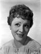 Irene Rich wearing a stylish stripe blouse with earrings - photo print