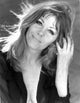 Ingrid Pitt wearing a black blazer photo print.