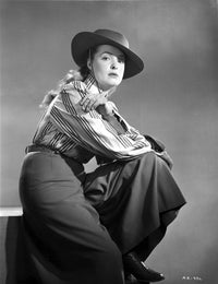 Classic photo print of Ann Richards sitting in a black long skirt.