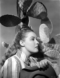 Ann Richards looking away under a cactus classic photo print