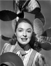 Ann Richards classic photo print with cactus background, showcasing her smile.