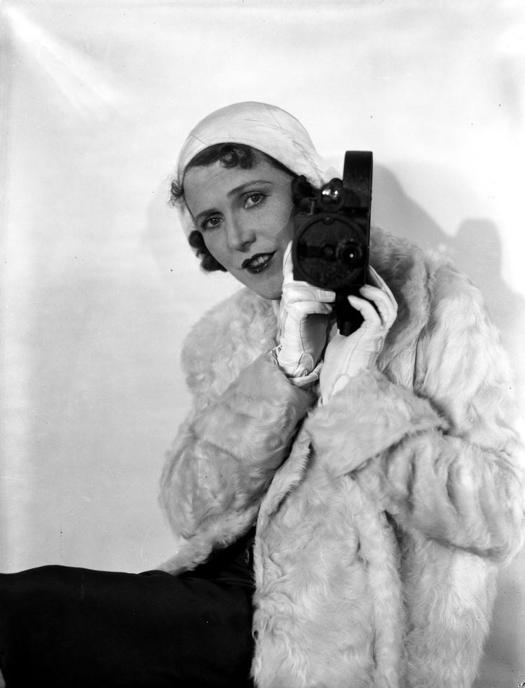 Ruth Roland holding camera in furry coat portrait photo print.