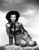 Gail Russell seated classic photo print showcasing vintage Hollywood elegance.