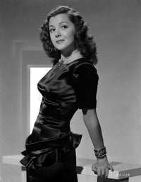 Ann Rutherford Charming Smile Photo Print leaning on a table.