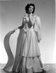 Peggy Ryan wearing an elegant white gown photo print