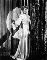 Ann Sheridan in a long glossy gown photo print