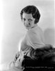 Sylvia Sidney leaning in a long sleeve dress photo print