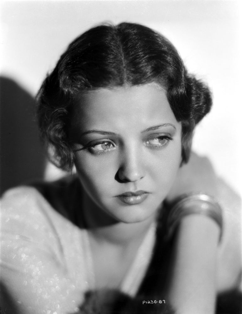 Sylvia Sidney posed in a white blouse with bracelet photo print