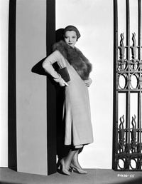 Sylvia Sidney leaning on wall in a furry scarf photo print.