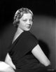 Sylvia Sidney posed in a black dress photo print.