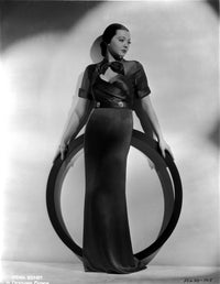 Sylvia Sidney photo print holding a ring in a long gown
